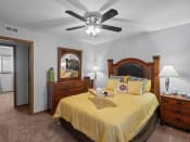 Thumbnail 9 of 22 - a bedroom with a bed and a ceiling fan