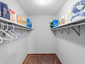 Thumbnail 10 of 22 - our spacious closet has shelves and hangers for clothes