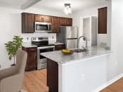 Thumbnail 3 of 30 - a kitchen with stainless steel appliances and a granite counter top