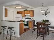 Thumbnail 20 of 30 - Beautiful open kitchen and dining area with breakfast bar in grand blanc, mi