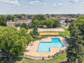 Thumbnail 17 of 26 - an aerial view of a swimming pool in a park with trees