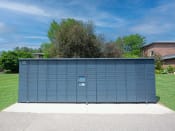 Thumbnail 22 of 32 - a large blue garage door in front of a grassy area