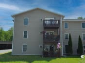 Thumbnail 25 of 32 - the back of a house with a balcony and an american flag