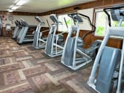 Thumbnail 12 of 32 - a row of elliptical machines in a fitness room