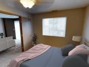 Thumbnail 4 of 10 - a bedroom with a bed and a window