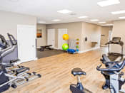 Thumbnail 16 of 19 - Gym at silver lake apartments with exercise equipment