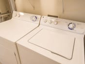 Thumbnail 9 of 19 - a washer and dryer in the laundry room of a home