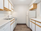Thumbnail 9 of 23 - apartment kitchen with white appliances and a refrigerator