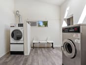 Thumbnail 15 of 23 - a washer and dryer in a laundry room
