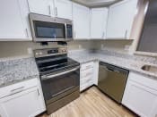 Thumbnail 1 of 16 - kitchen with lots of storage space and upgraded appliances