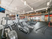 Thumbnail 5 of 19 - Apartment Fitness Center with Cardio Machines