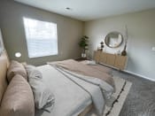 Thumbnail 6 of 21 - a bedroom with gray walls and a large window