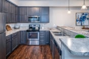 Thumbnail 1 of 34 - Arbors at Turnberry pet friendly apartments and townhomes Pickerington, Ohio large kitchen, wood style flooring, stainless steel appliances, cabinet space