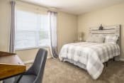 Thumbnail 17 of 34 - Arbors at Turnberry Apartments Pickerington Ohio Pet Friendly Updated Modern Bedroom, natural light, queen bed and desk