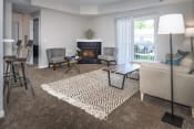 Thumbnail 15 of 34 - Arbors at Turnberry pet friendly apartments and townhomes Pickerington, Ohio spacious living room with carpet flooring and natural light