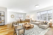Thumbnail 4 of 15 - a living room with a couch coffee table and chairs  at Summit Wood Apartments, New York, 13601