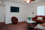 Thumbnail 5 of 26 - a living room with white walls and a brown carpet