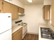 Thumbnail 10 of 56 - Fully Furnished Kitchen at Woodlands Village Apartments, Flagstaff, AZ