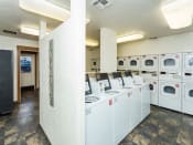 Thumbnail 6 of 56 - Laundry Room at Woodlands Village Apartments, Flagstaff