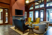 Thumbnail 20 of 39 - Grand Clubhouse Living Room at The Retreat Apartment Homes, Williston, ND, 58801