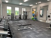 Thumbnail 36 of 52 - Fitness Center with Weights at Canebrake Apartment Homes, Shreveport, Louisiana, 71115