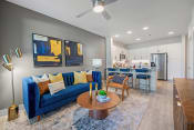 Thumbnail 9 of 34 - Living Room with Blue Accents at Alta Denton Station, Denton, Texas