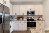 Thumbnail 8 of 50 - Chef-Inspired Kitchens Feature Stainless Steel Appliances at Alta Farms at Cane Ridge, Tennessee, 37013