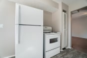Thumbnail 9 of 46 - Kitchen With White Cabinetry And Appliances at Finneytown Apartments and Townhomes, Cincinnati, Ohio