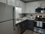 Thumbnail 12 of 42 - Back and White kitchen at SoDel, Kettering, OH