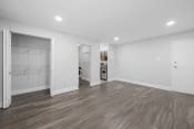Thumbnail 31 of 34 - a renovated living room with white walls and wood flooring