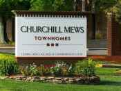 Thumbnail 5 of 18 - Placard with the Churchill Mews logo near apartments entrance