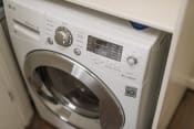 Thumbnail 2 of 13 - a white washer and dryer sitting next to each other