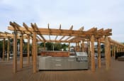 Thumbnail 19 of 22 - an outdoor kitchen with a pergola on top of it