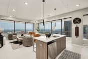 Thumbnail 1 of 22 - a kitchen and living room with a view of the city at The 600 Apartments, Birmingham