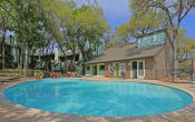 Thumbnail 15 of 25 - a swimming pool with a house in the background  at Elevate at Huebner Grove, San Antonio, Texas