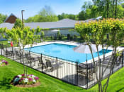 Thumbnail 1 of 16 - a swimming pool with a fence around it at Chesterfieldfield Garden Apartments, Chesterfield, VA, 23836