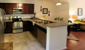 Thumbnail 13 of 36 - a large kitchen with a counter top at Chester Village Green Apartments, Virginia