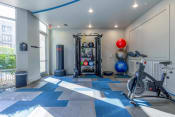 Thumbnail 32 of 53 - a home gym with weights and other exercise equipment and a window