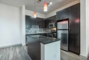 Thumbnail 51 of 53 - a kitchen with stainless steel appliances and a counter top