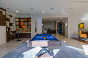 Thumbnail 19 of 53 - a game room with a pool table and a bar