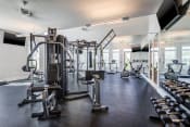 Thumbnail 44 of 48 - a large fitness room with cardio equipment and weights