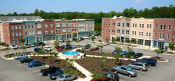 Thumbnail 36 of 36 - an aerial view of an apartment complex with a pool and parking lot at Chester Village Green Apartments, Chester