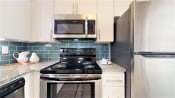 Thumbnail 6 of 28 - Updated Kitchens with White Cabinets and Stainless Steele Appliances  at Cumberland Pointe, Smyrna, 30080
