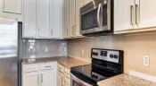 Thumbnail 16 of 26 - Cabinets in kitchen at Eleven 85 Apartments, Atlanta, GA, 30318