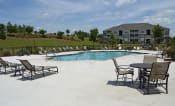 Thumbnail 9 of 25 - Sparkling pool with sundeck and lounge chairs at the Haven at Market Street Station Johnson City, TN