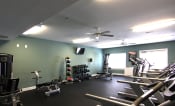 Thumbnail 29 of 47 - Fitness center with dumb bells at the Haven at Reed Creek Martinez, GA