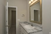 Thumbnail 29 of 31 - Modern bathroom with large mirror Highborne apartments Augusta, GA