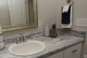 Thumbnail 19 of 31 - Spacious bathroom with white cabinets and tub at HIghborne apartments Augusta, GA