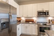 Thumbnail 13 of 24 - Fully Equipped Kitchen at Ansley Park Apartments, North Carolina, 28412