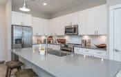 Thumbnail 12 of 24 - Granite Counter Tops In Kitchen atat Ansley Park Apartments, North Carolina, 28412